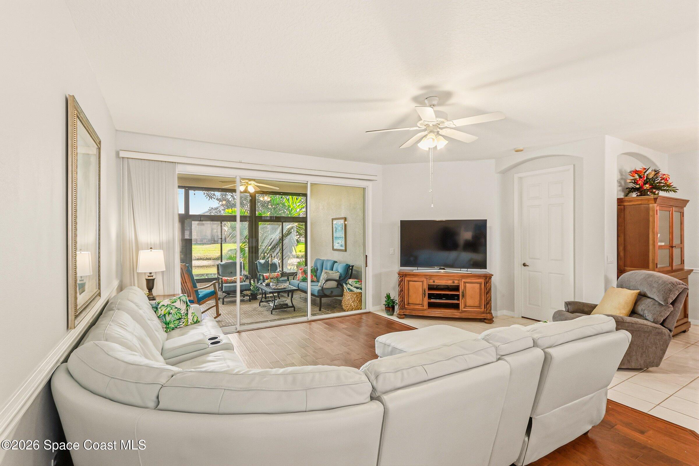 1825 Ficus Point Drive Melbourne, FL 32940 - Photo 11 of 48 a living room with furniture and a flat screen tv
