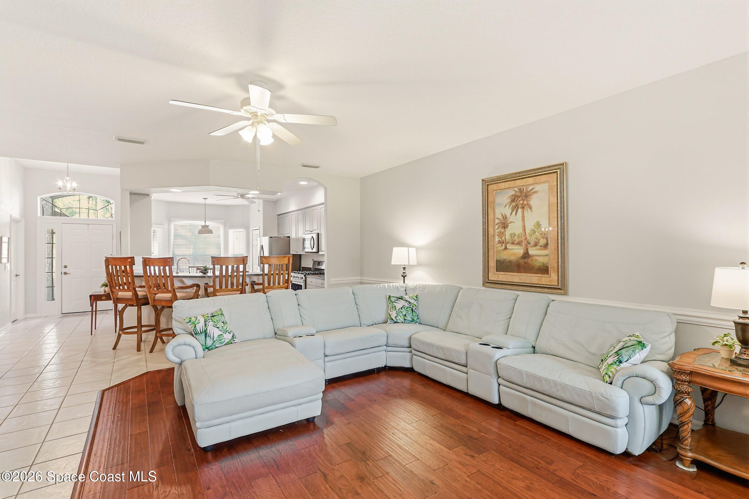 1825 Ficus Point Drive Melbourne, FL 32940 - Photo 14 of 48 a living room with furniture and a large window