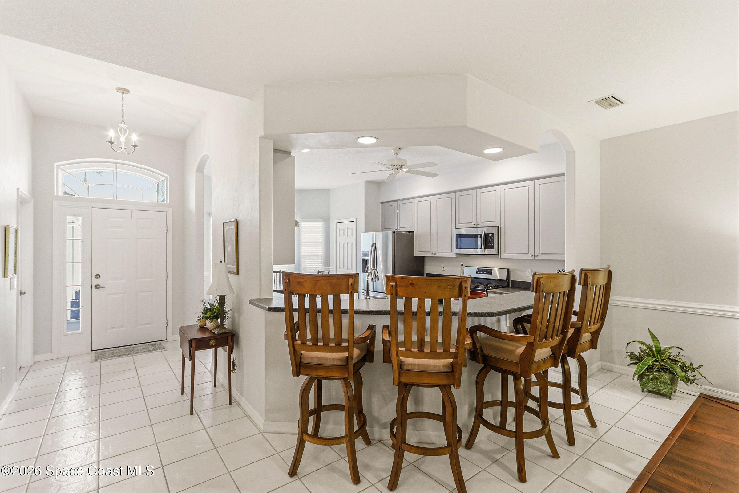1825 Ficus Point Drive Melbourne, FL 32940 - Photo 20 of 48 a view of a dining room with furniture