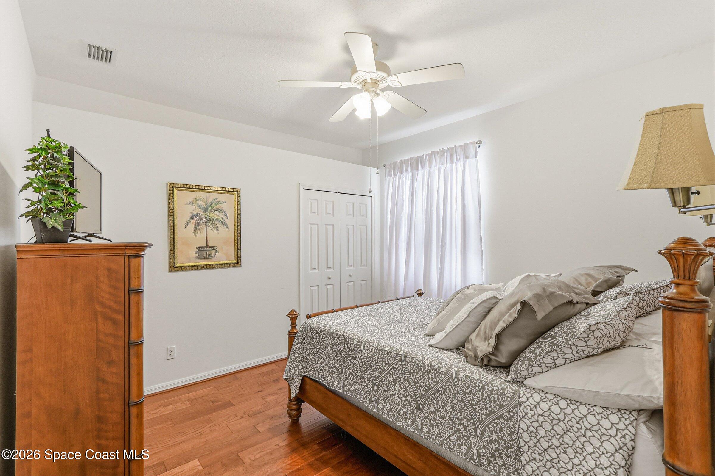 1825 Ficus Point Drive Melbourne, FL 32940 - Photo 25 of 48 a bedroom with a bed and a window