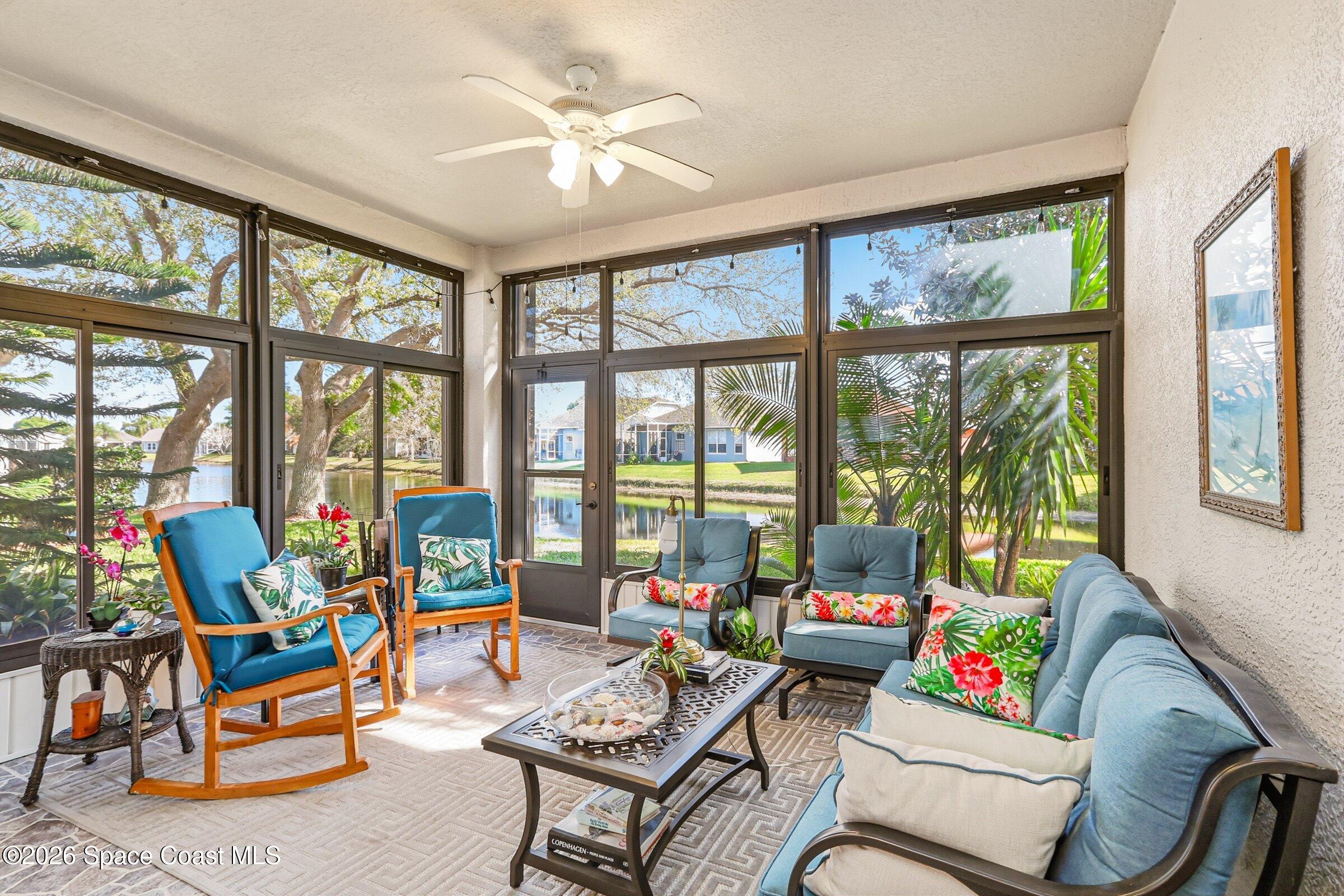 1825 Ficus Point Drive Melbourne, FL 32940 - Photo 28 of 48 a living room with furniture and a large window