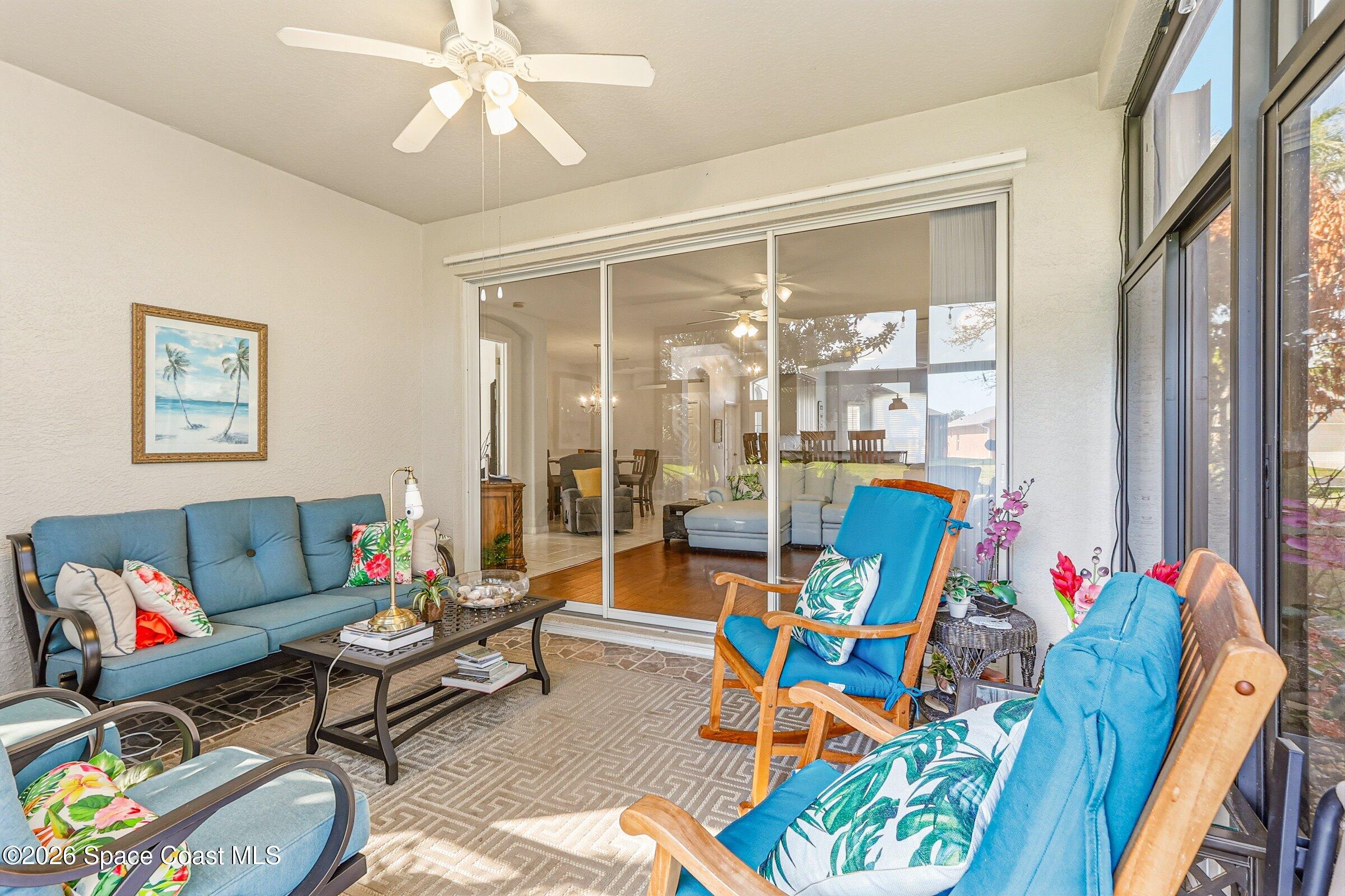 1825 Ficus Point Drive Melbourne, FL 32940 - Photo 29 of 48 a living room with furniture and a large window