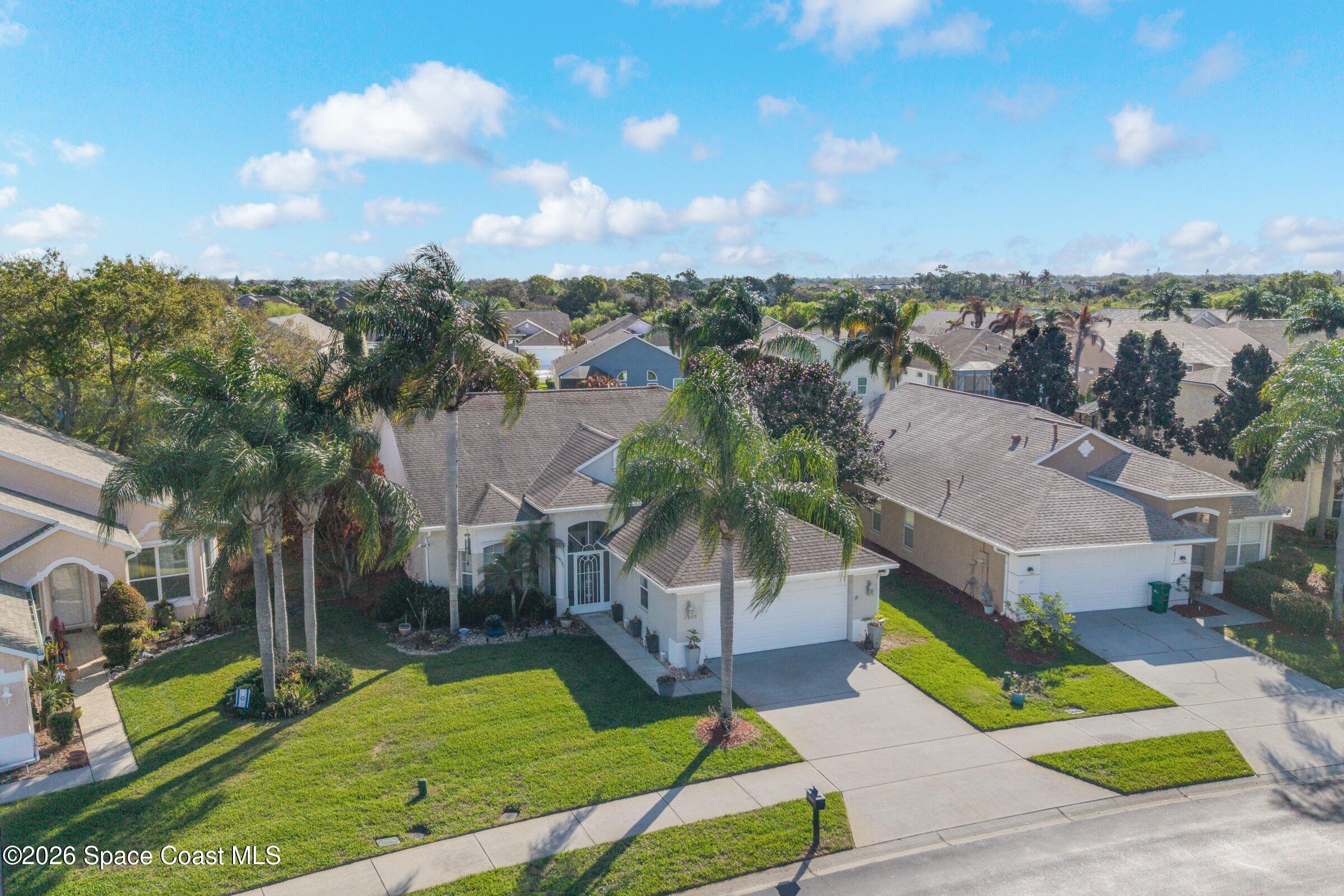 1825 Ficus Point Drive Melbourne, FL 32940 - Photo 3 of 48 an aerial view of a house with garden space and street view