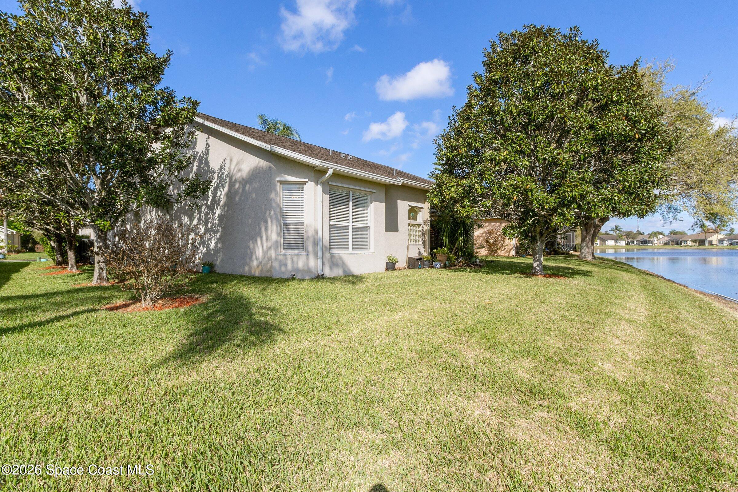 1825 Ficus Point Drive Melbourne, FL 32940 - Photo 32 of 48 a view of a house with basketball court