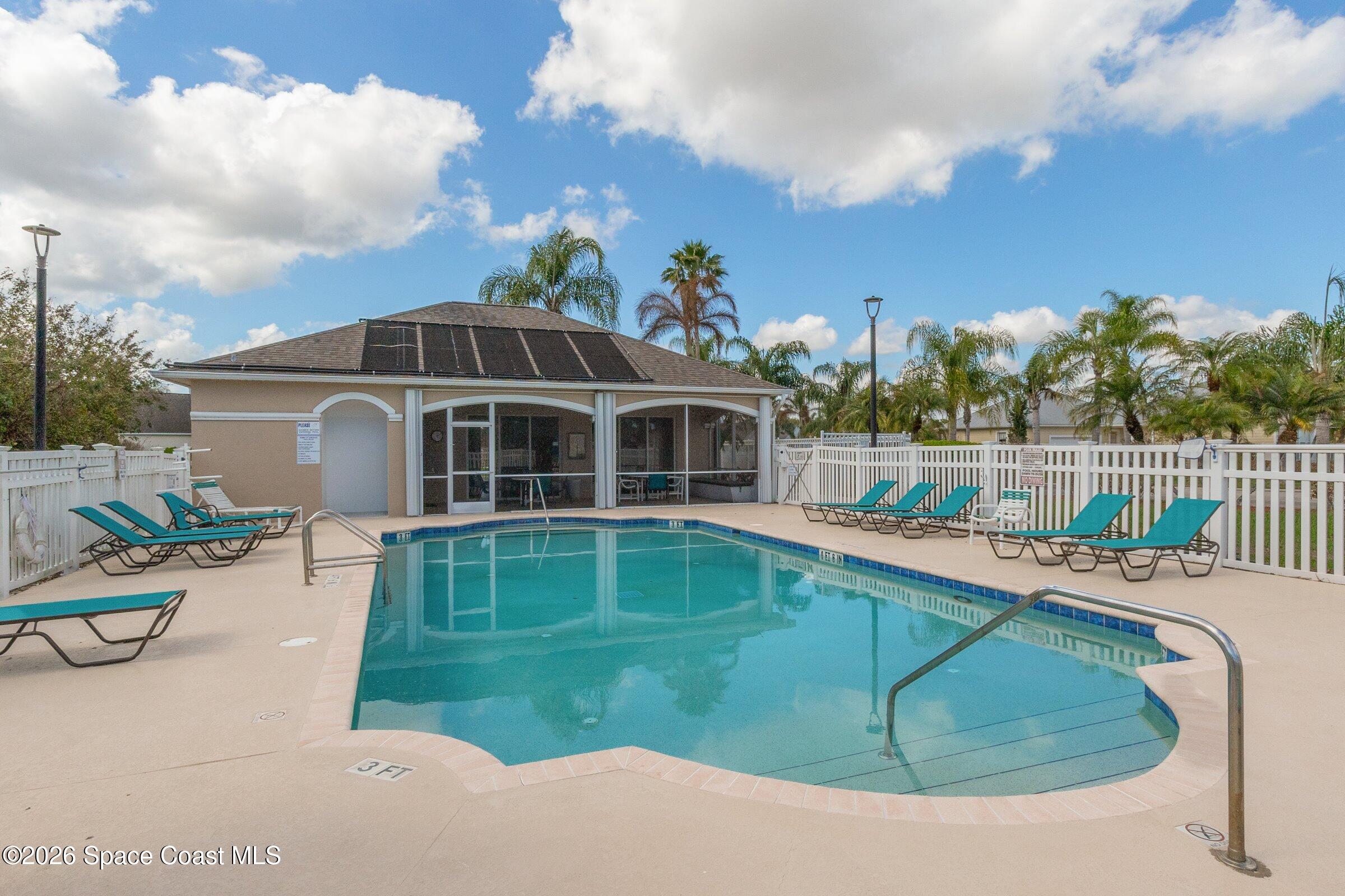 1825 Ficus Point Drive Melbourne, FL 32940 - Photo 34 of 48 a view of a house with a swimming pool and sitting area