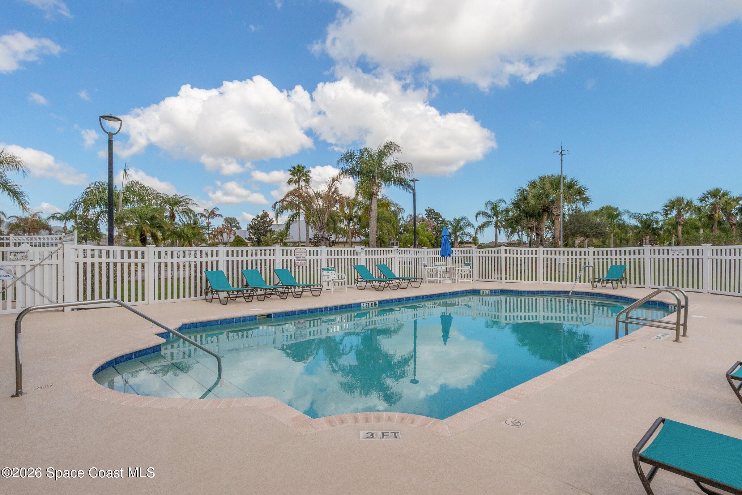 1825 Ficus Point Drive Melbourne, FL 32940 - Photo 35 of 48 a view of a swimming pool with a terrace