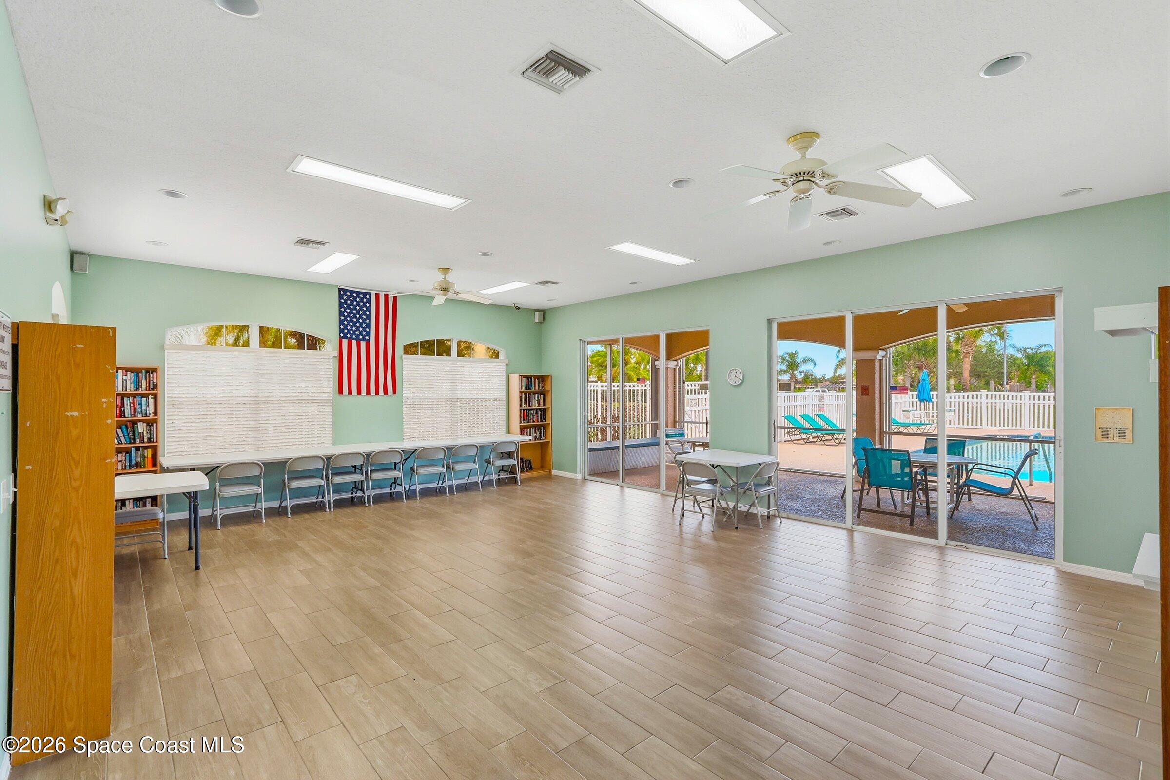 1825 Ficus Point Drive Melbourne, FL 32940 - Photo 40 of 48 a view of empty room with wooden floor and fan