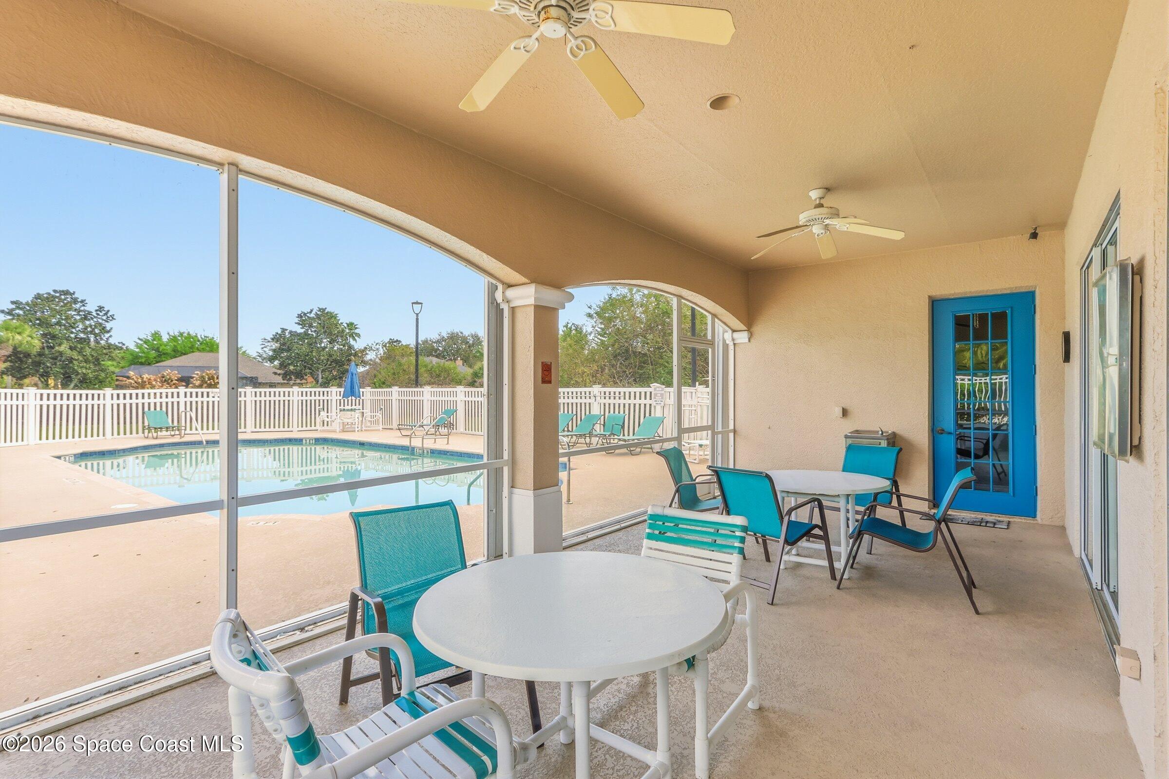 1825 Ficus Point Drive Melbourne, FL 32940 - Photo 41 of 48 a living room with furniture and a floor to ceiling window