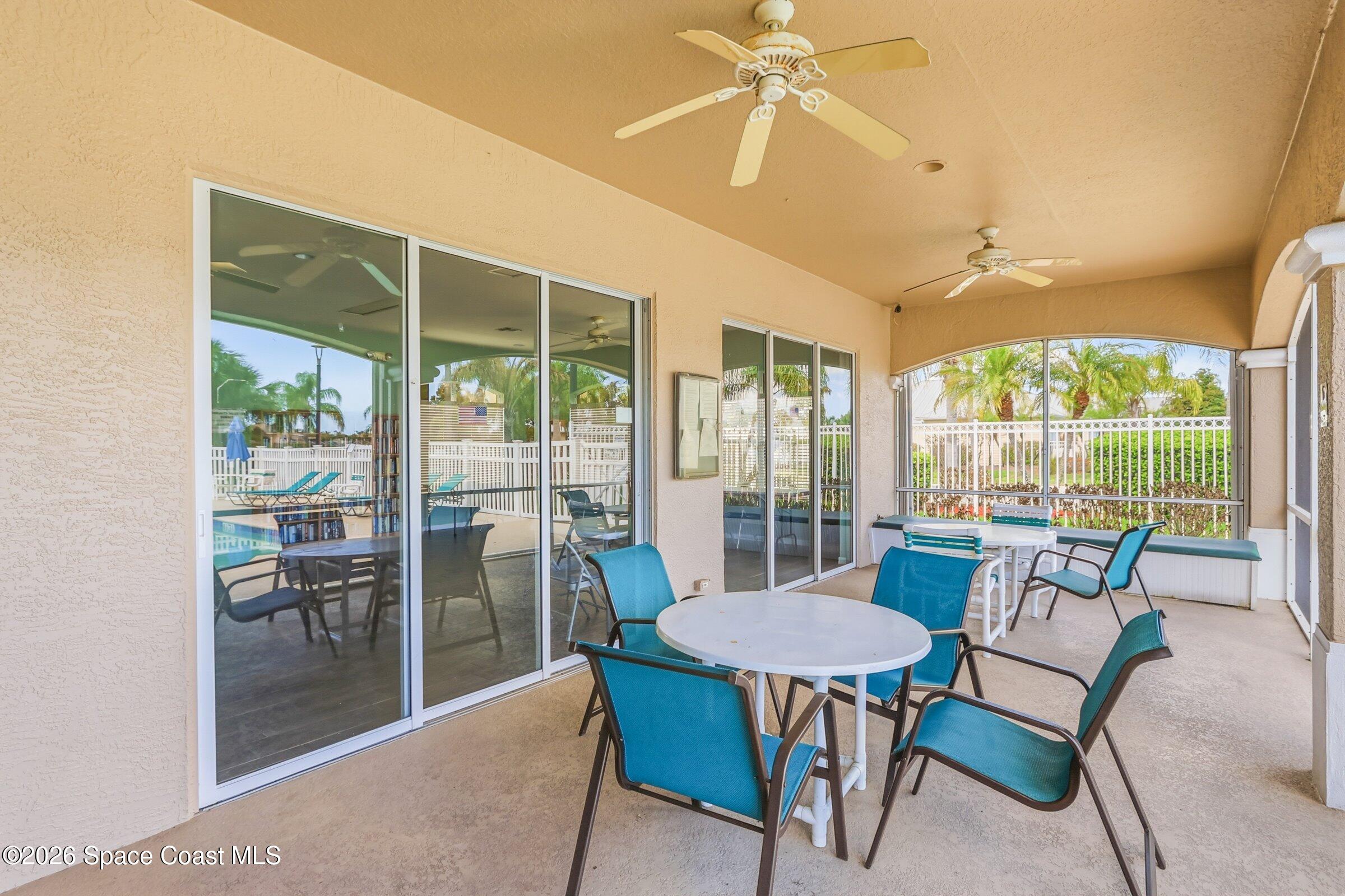 1825 Ficus Point Drive Melbourne, FL 32940 - Photo 42 of 48 a view of a dining room with furniture wooden floor and chandelier