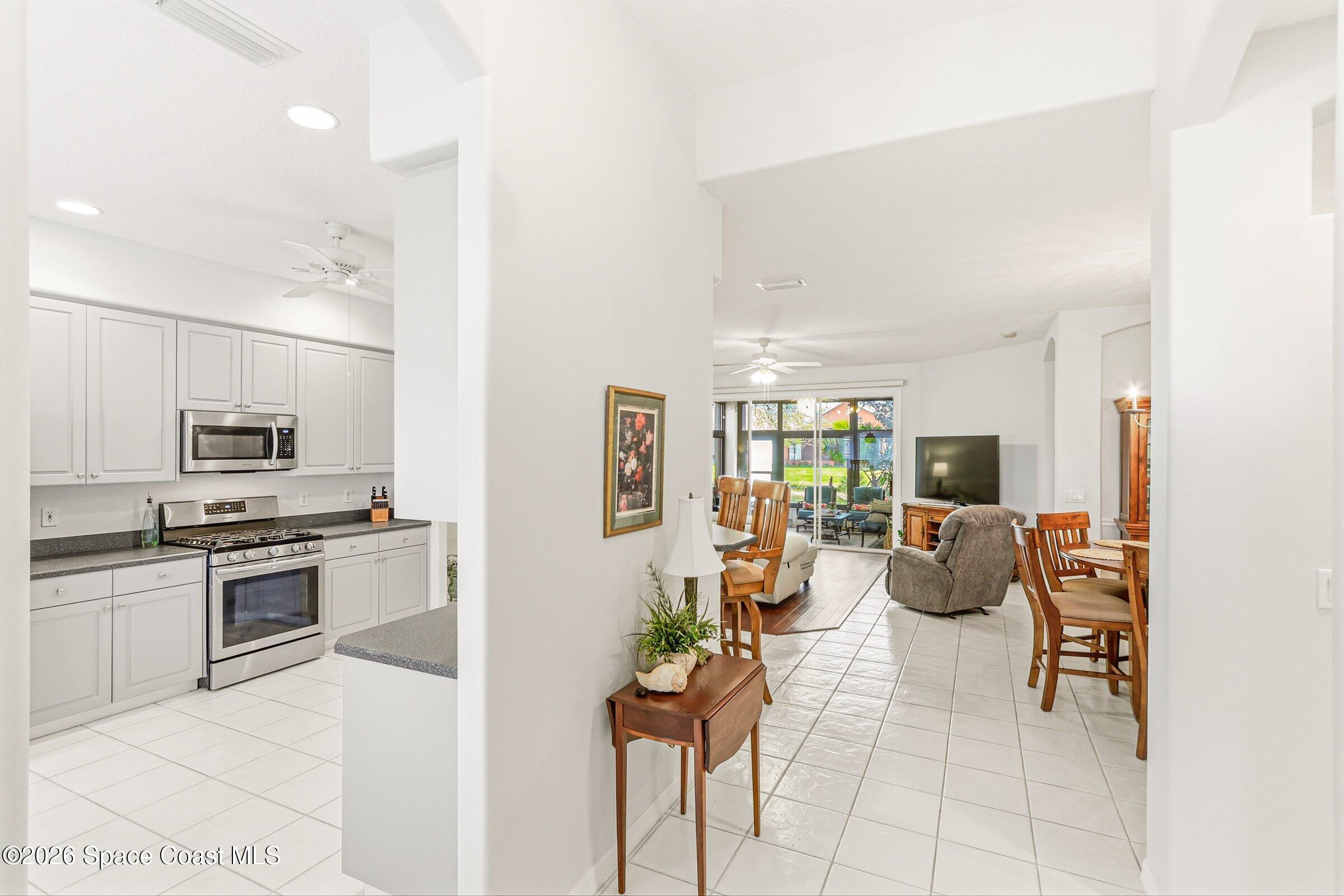 1825 Ficus Point Drive Melbourne, FL 32940 - Photo 8 of 48 a living room with stainless steel appliances furniture and a kitchen view