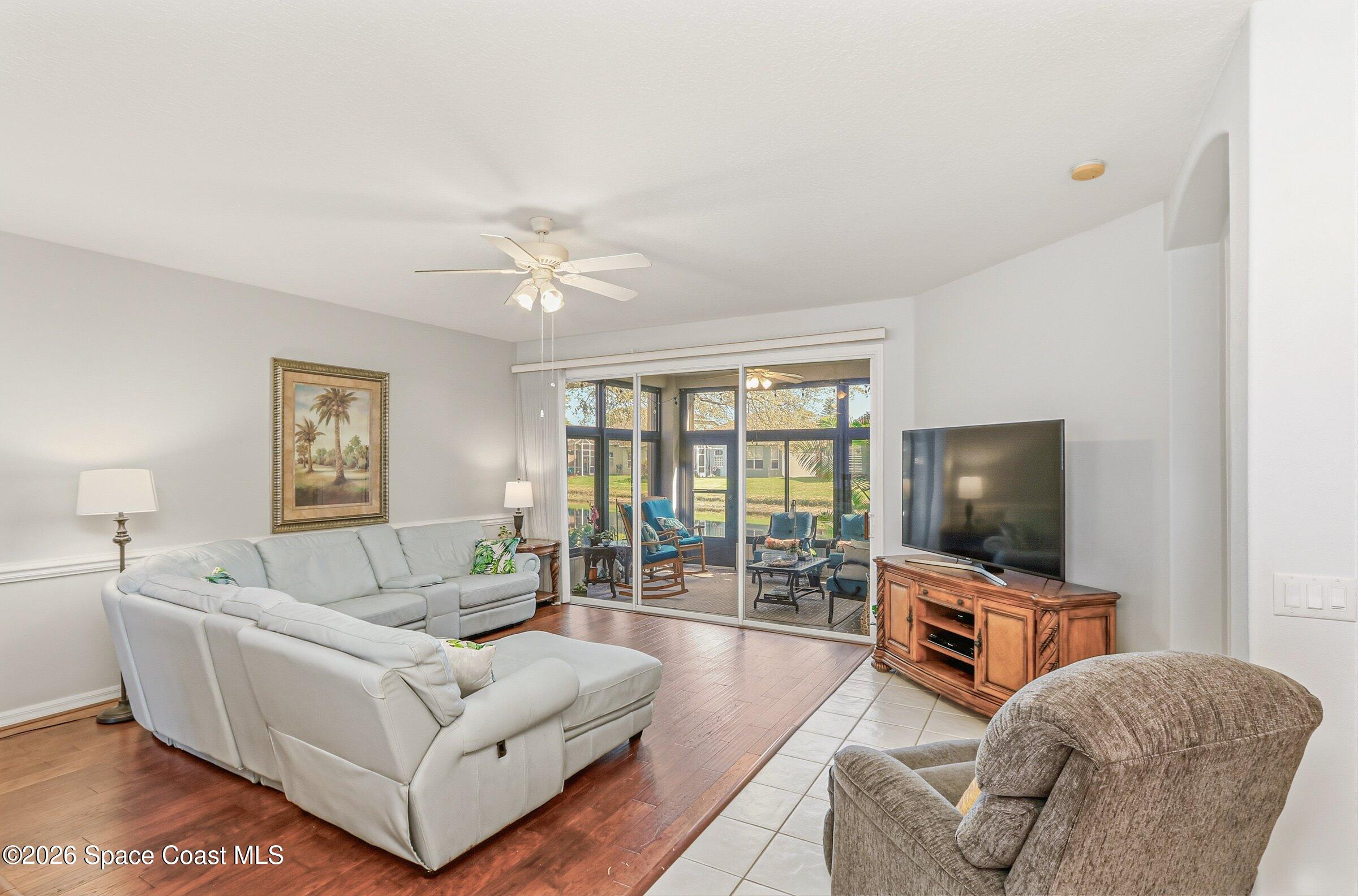 1825 Ficus Point Drive Melbourne, FL 32940 - Photo 10 of 48 a living room with furniture and a flat screen tv