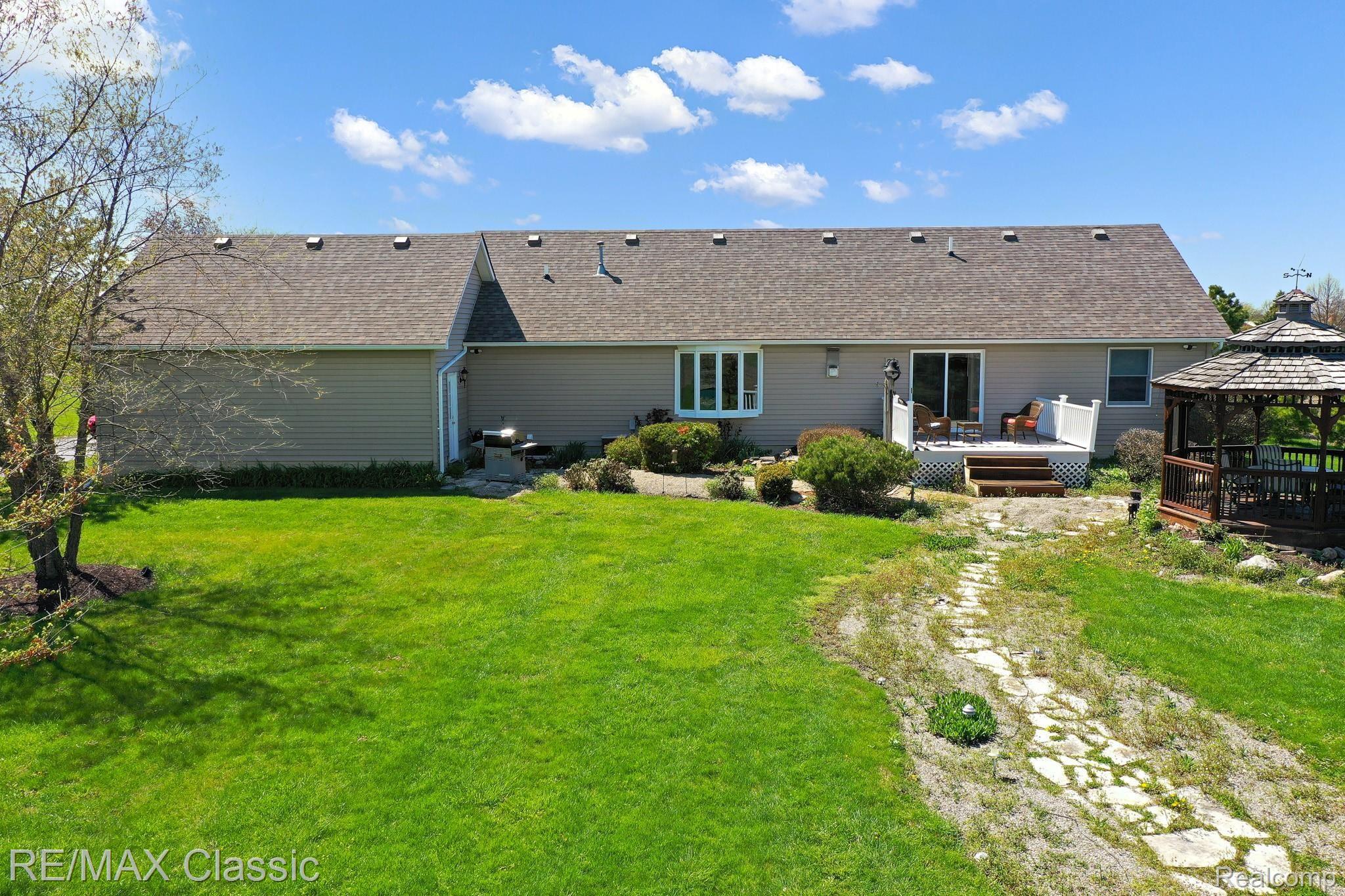 8530 Chinavare Road Newport, MI 48166 - Photo 4 of 34 Back Yard is Nicely Landscaped - Enclosed Gazebo
