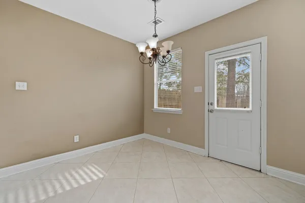 a kitchen with granite countertop a sink and a stove top oven