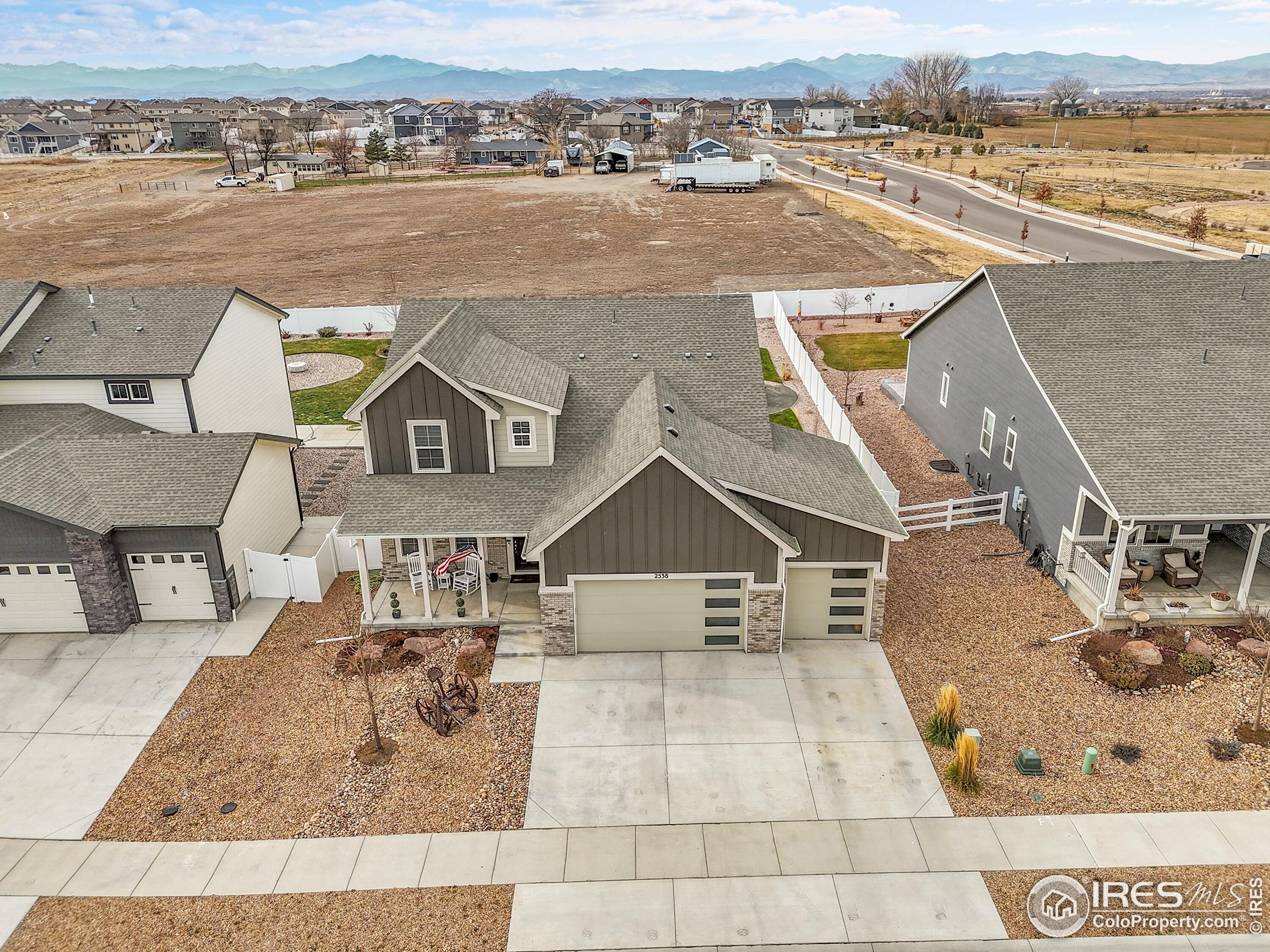 2538 Doe Rdg Way Johnstown, CO 80534 - Photo 33 of 33 an aerial view of a house with lake view