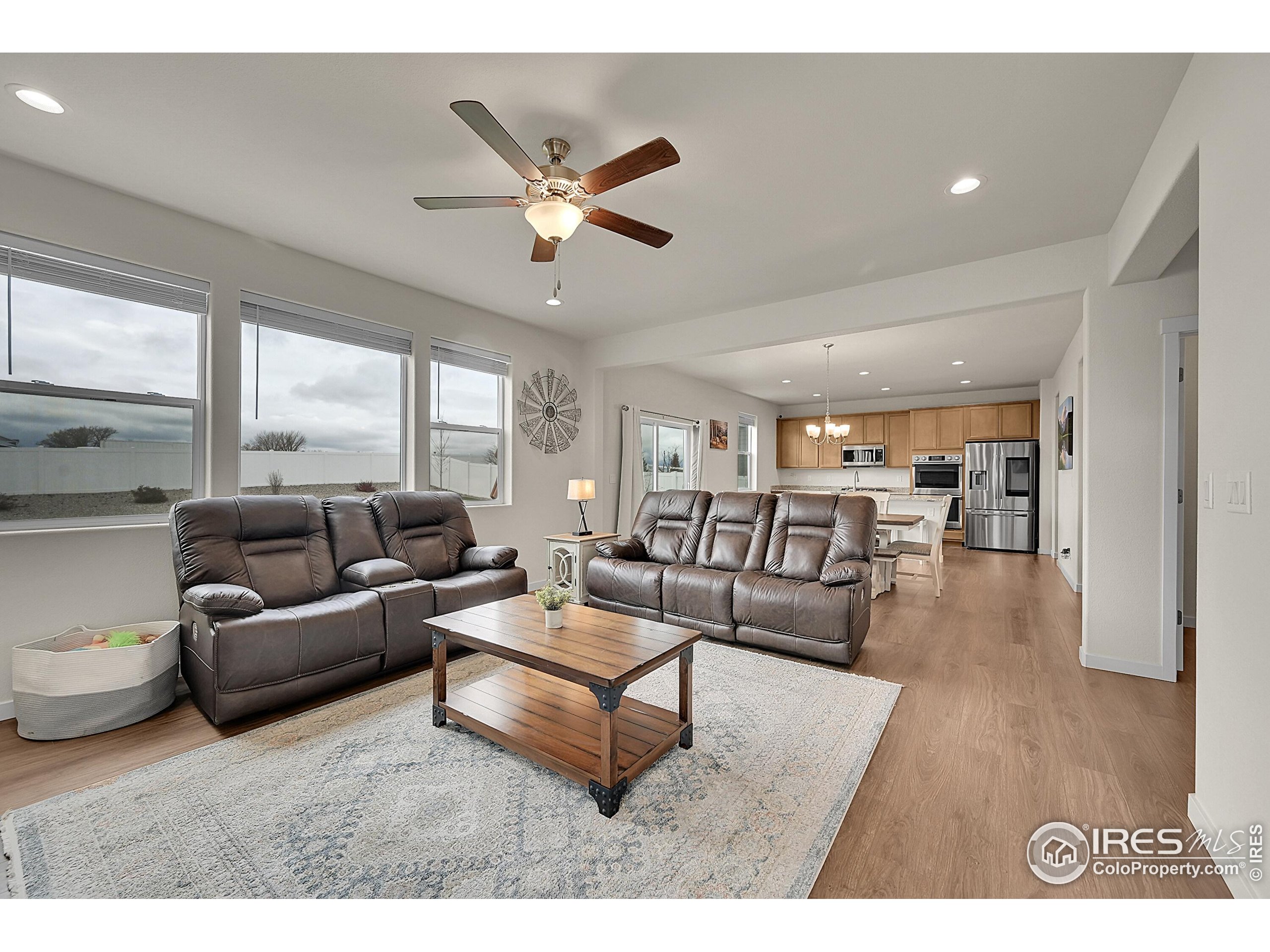 2538 Doe Rdg Way Johnstown, CO 80534 - Photo 6 of 33 a living room with furniture and a wooden floor