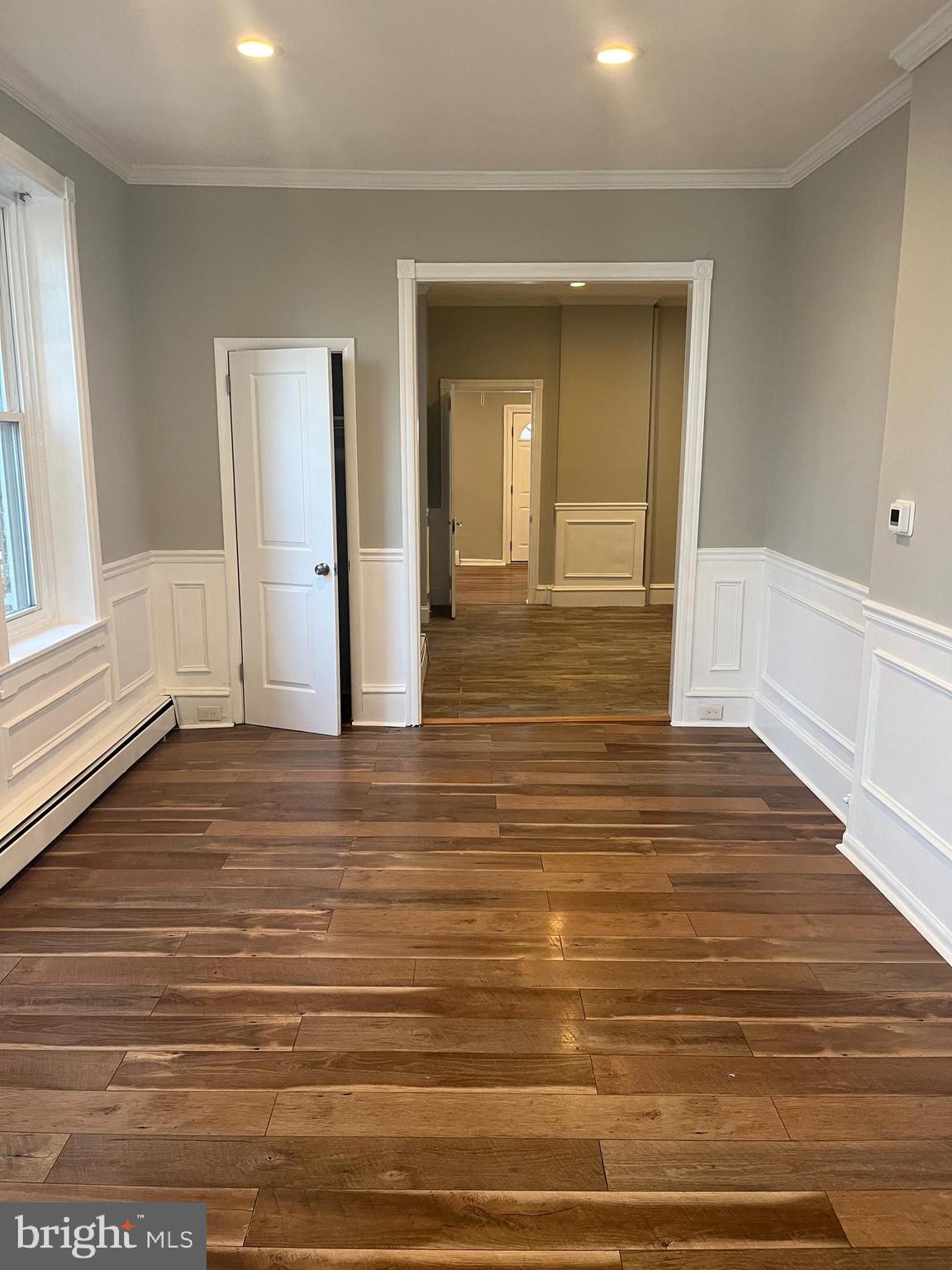 55 North Main Street Chalfont, PA 18914 - Photo 13 of 15 a view of a hallway with wooden floor and staircase