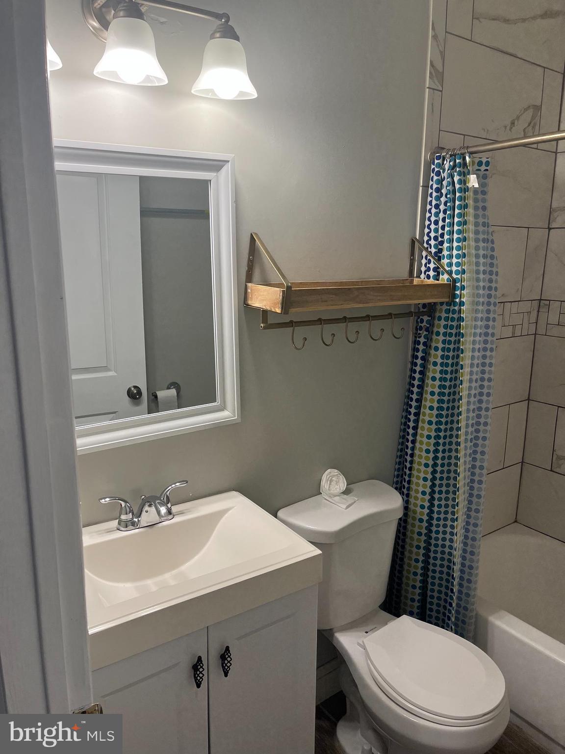 55 North Main Street Chalfont, PA 18914 - Photo 14 of 15 a bathroom with a sink a toilet and shower