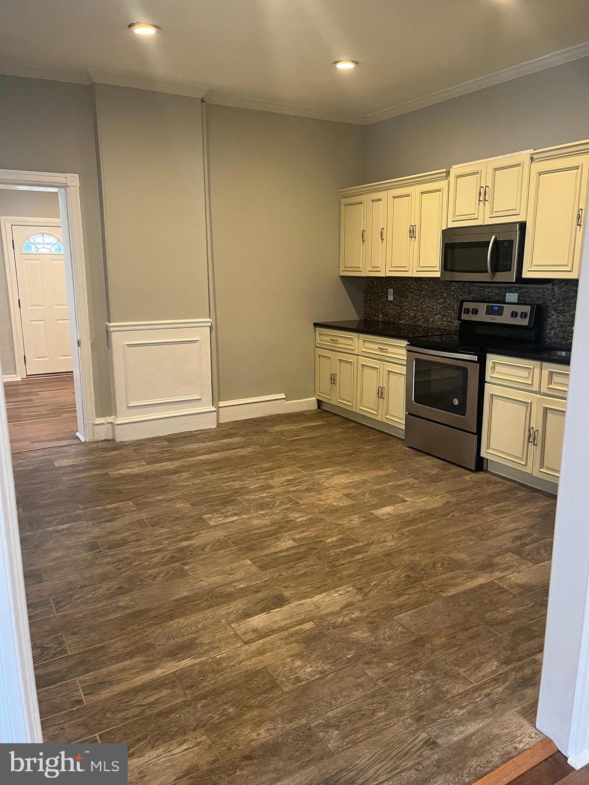 55 North Main Street Chalfont, PA 18914 - Photo 8 of 15 a kitchen with granite countertop a stove a sink and a granite counter tops