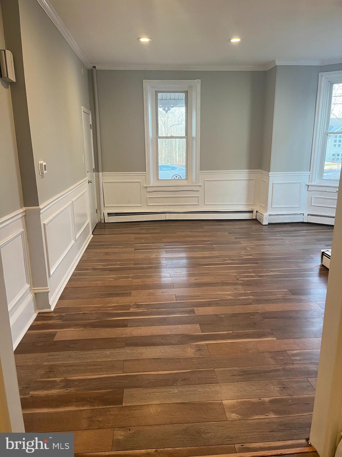 55 North Main Street Chalfont, PA 18914 - Photo 10 of 15 a view of empty room with wooden floor and fan