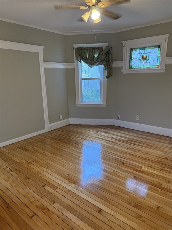 395 Talbot Avenue, Unit 1 Boston, MA 02124 - Photo 2 of 7 a view of room with window and wooden floor