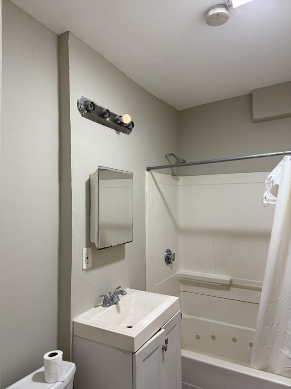 395 Talbot Avenue, Unit 1 Boston, MA 02124 - Photo 5 of 7 a bathroom with a sink and a mirror