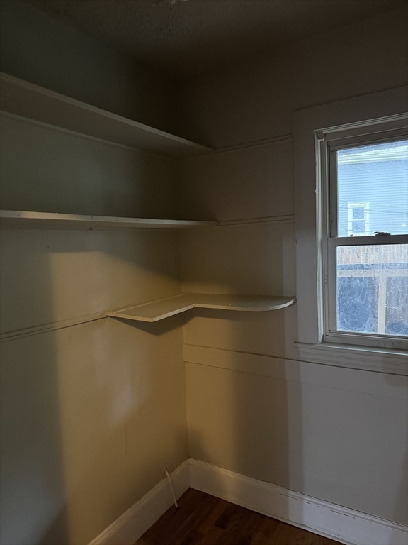 395 Talbot Avenue, Unit 1 Boston, MA 02124 - Photo 6 of 7 a view of a small space with racks on the wall