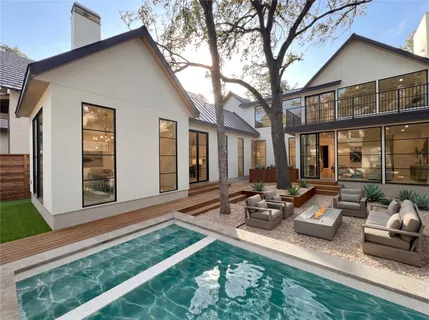 a group of couches sitting in front of house