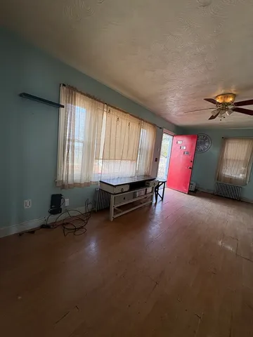 a room with gym equipment and a window