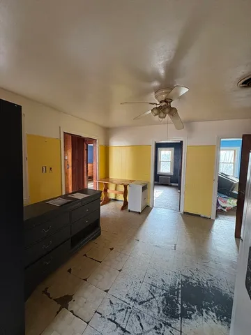 a view of a livingroom with furniture and a window