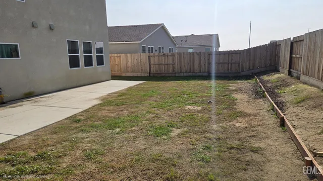 an aerial view of houses with outdoor space