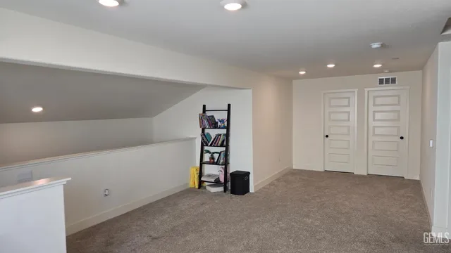 a bed room with a bed and a mirror