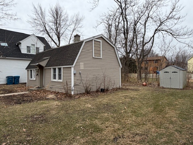 5938 Dunham Road Downers Grove, IL 60516 - Photo 15 of 16 a view of a house with a yard