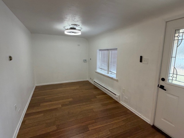 5938 Dunham Road Downers Grove, IL 60516 - Photo 3 of 16 wooden floor in an empty room with a window