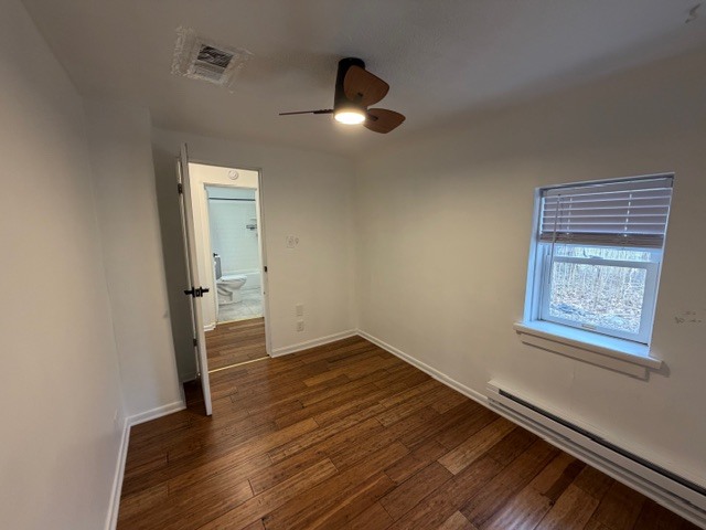 5938 Dunham Road Downers Grove, IL 60516 - Photo 9 of 16 an empty room with wooden floor and windows