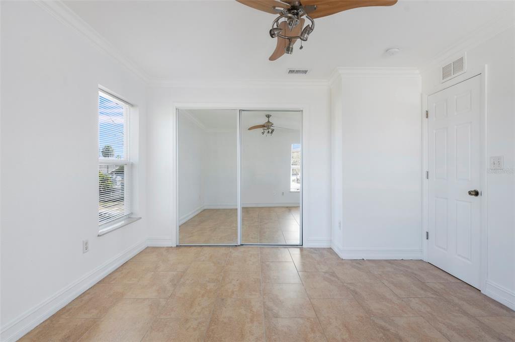 114 143rd Avenue, Unit A Madeira Beach, FL 33708 - Photo 12 of 15 wooden floor in an empty room