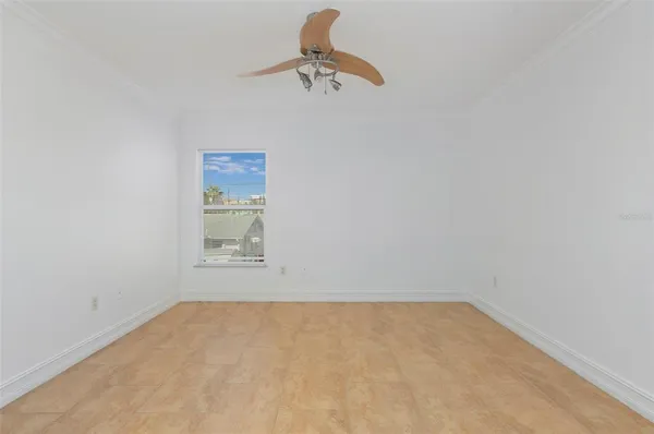 a bathroom with a window and a ceiling fan