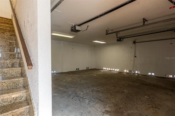 a view of an empty room with stairs
