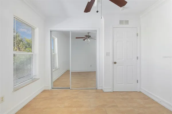 a view of an empty room with a window