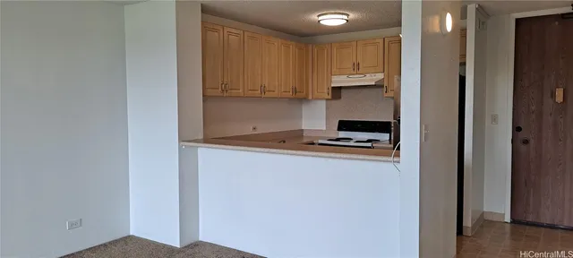 a kitchen with a refrigerator and cabinets