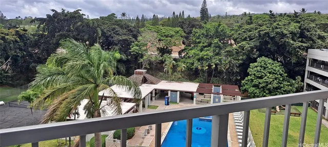 a view of a balcony with chairs