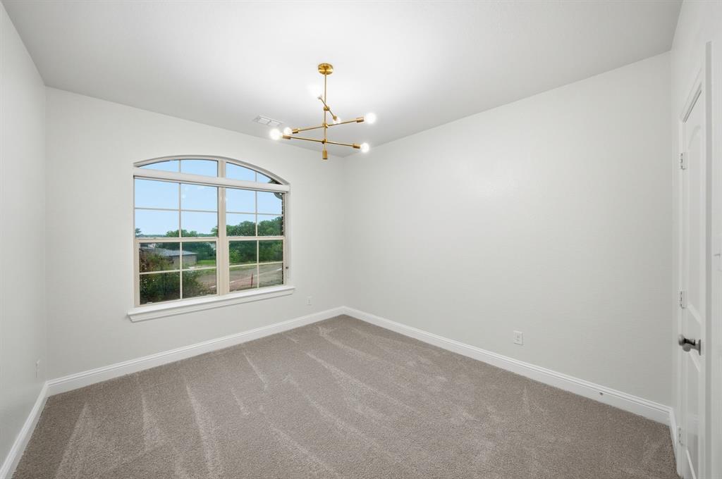 624 Sorrell Road McKinney, TX 75072 - Photo 22 of 28 wooden floor in an empty room with a window