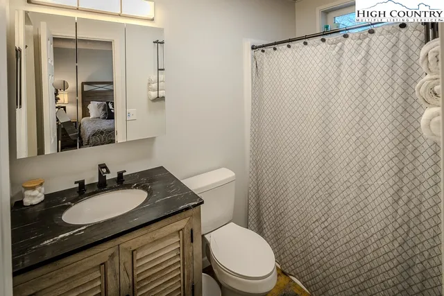 a view of balcony with wooden floor and fence