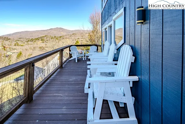 a view of balcony with furniture