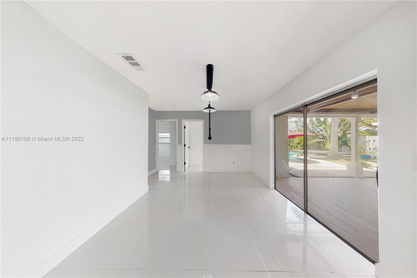 4641 Armadillo Street Boca Raton, FL 33428 - Photo 12 of 60 a view of empty room with wooden floor