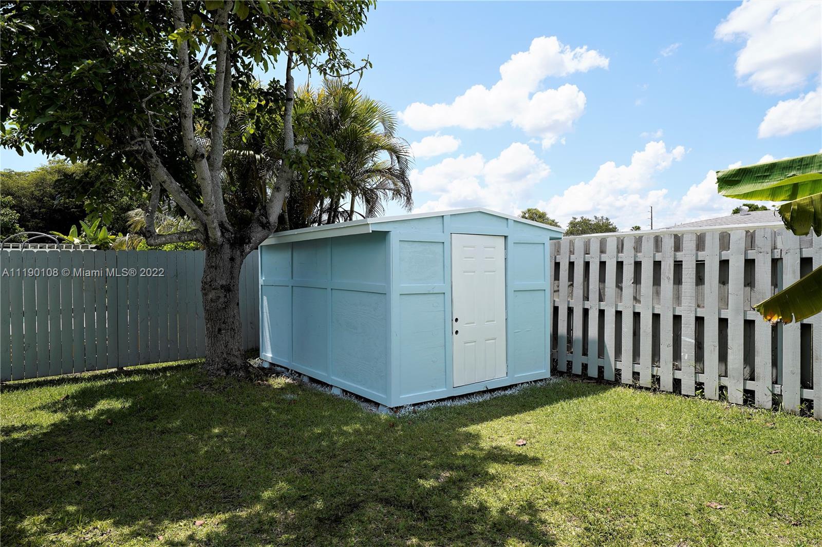 4641 Armadillo Street Boca Raton, FL 33428 - Photo 39 of 60 a view of a backyard