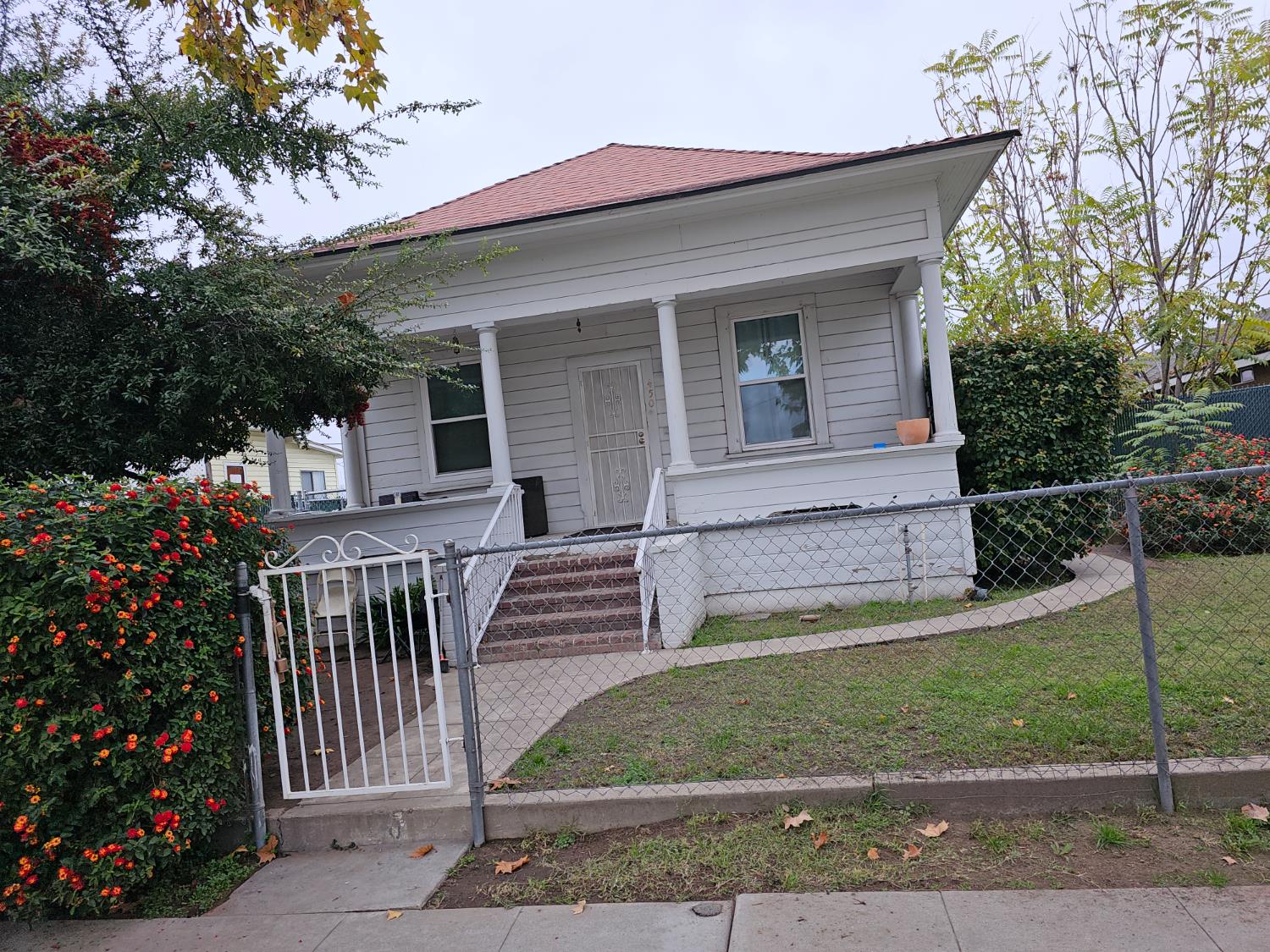 450 C Street Fresno, CA 93706 - Photo 2 of 22 front view of house with a yard