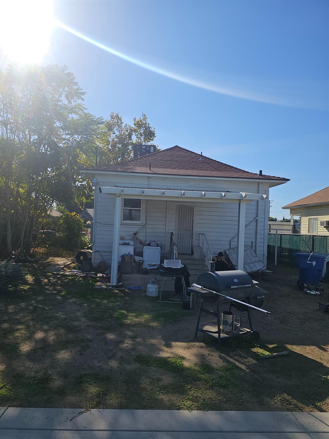 450 C Street Fresno, CA 93706 - Photo 3 of 22 a view of a house with backyard sitting area and garden