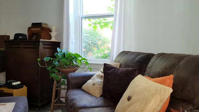 a living room with furniture and a window