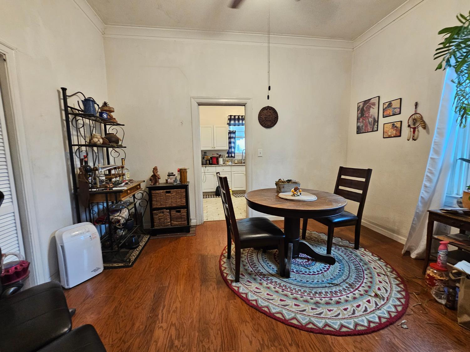 450 C Street Fresno, CA 93706 - Photo 5 of 22 a living room with furniture and a wooden floor