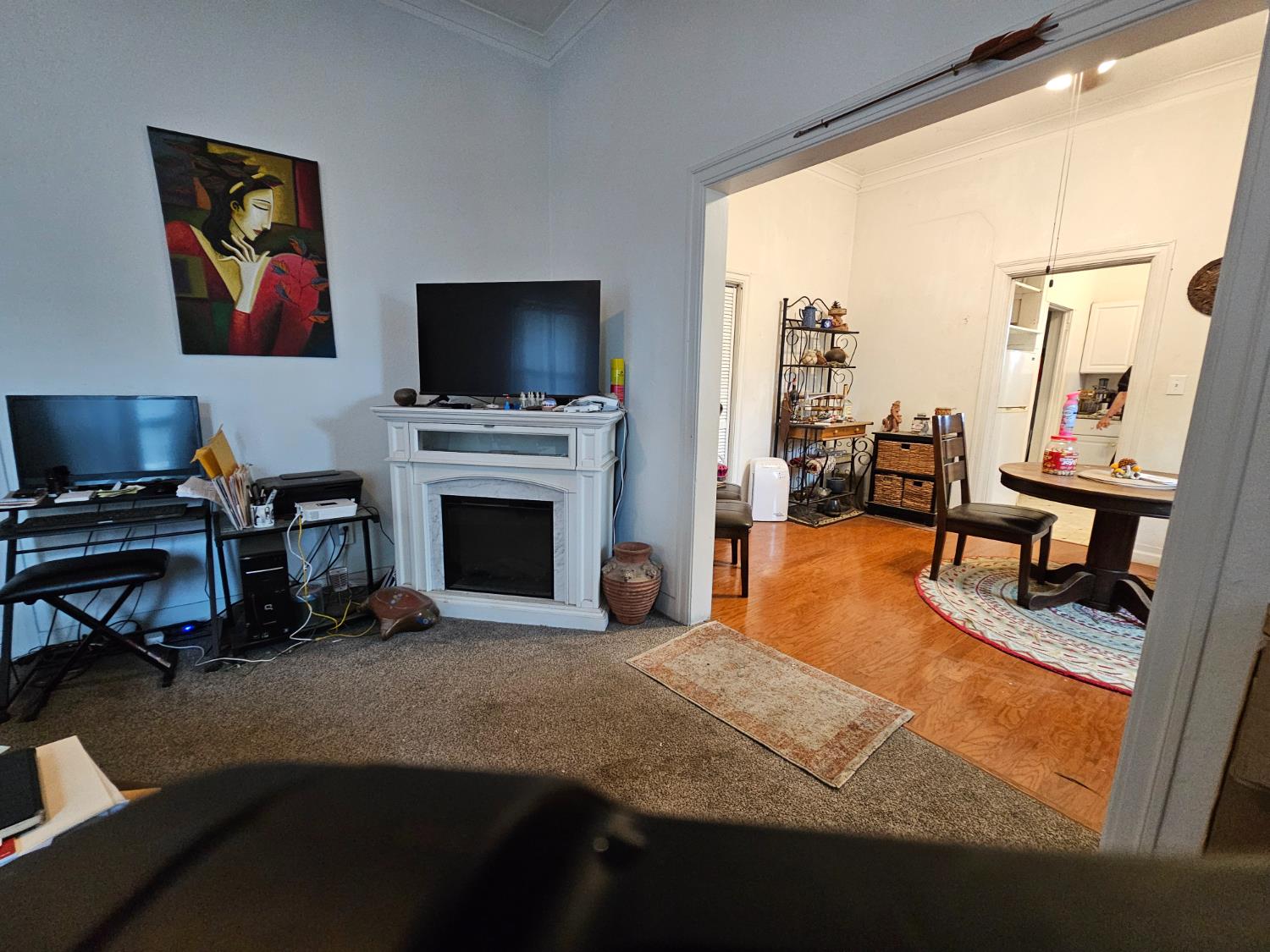 450 C Street Fresno, CA 93706 - Photo 9 of 22 a bedroom with furniture and a fireplace